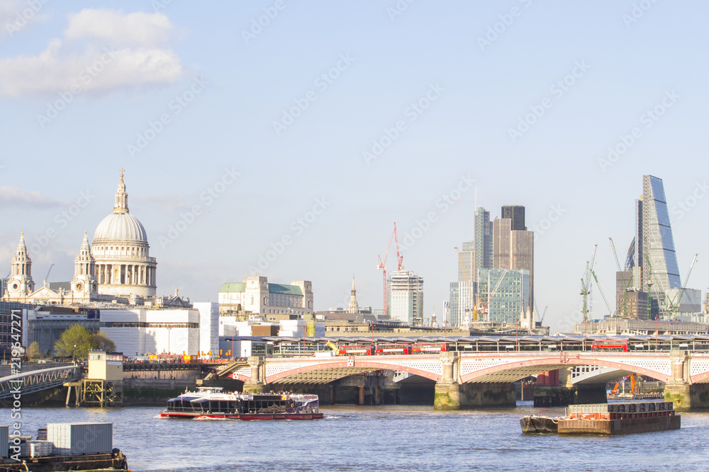 Cityscape of the City and view of St Paul Cathedral in a sunny day, London, Uk.