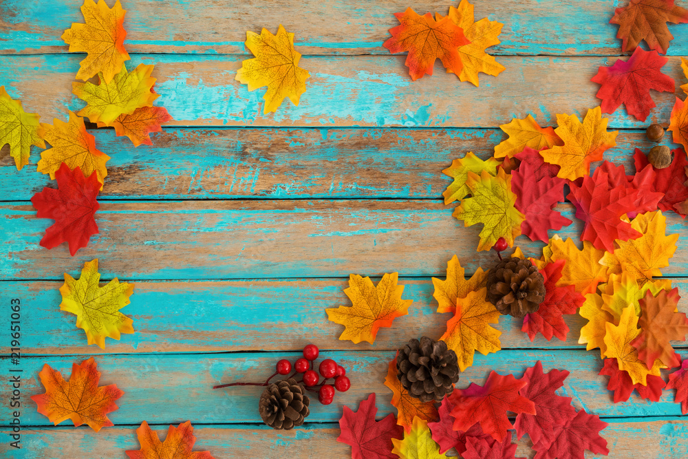 Beautiful frame composed of autumn maple leaves with pine cones, berry ...