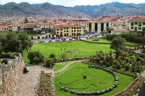 Garden Outside Coricancha Temple in Cusco of Peru, with the Symbol of Inca Mythology of Condor, Puma and Snake photo