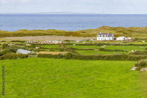 Фотография Farm in the Fanore village with Aran islands in background