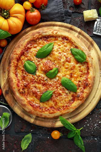 Stone Baked Pizza margherita with farm tomatoes sauce, parmesan and mozzarella cheese, basil