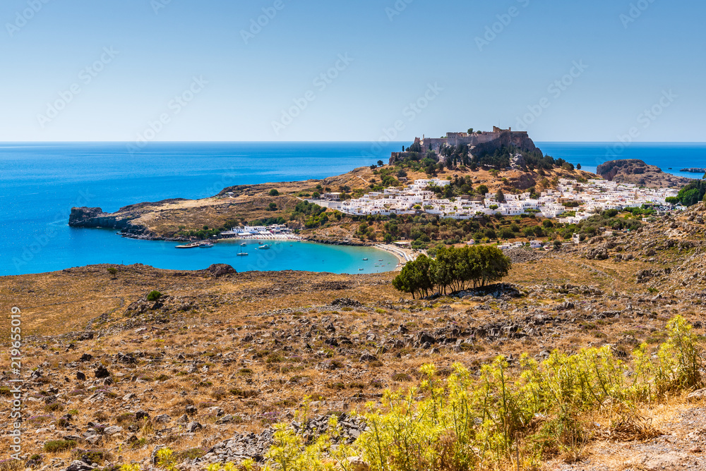 View of the bay and the village of Lindos with the Acropolis on the hill.Rhodes, island, Greece