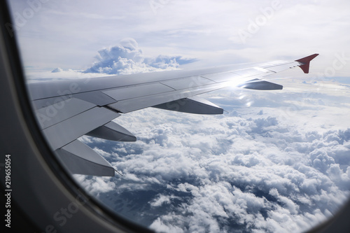 Cloudy with Wing of an airplane.Traveling concept