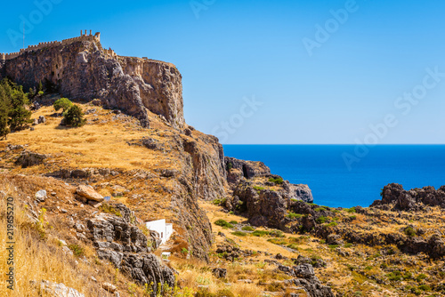 View of the bay and the Acropolis on the hill. Lindos village on Rhodes, island, Greece