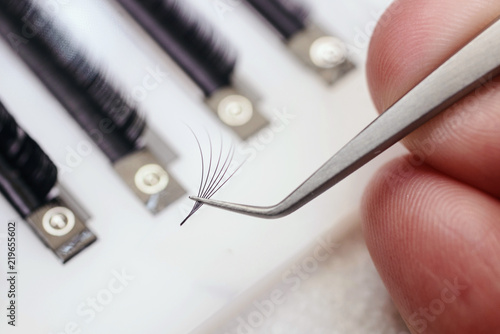 Eyelash Extension Procedure. Woman Eye with Long Eyelashes. Lashes, close up, macro, selective focus