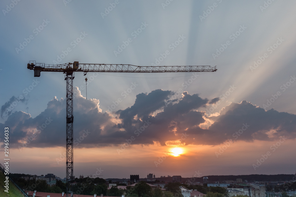 Construction crane during the sunset Construction crane during the sunset