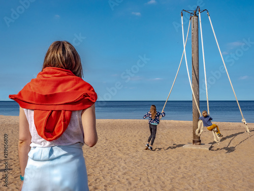 A woman looks at the play o...