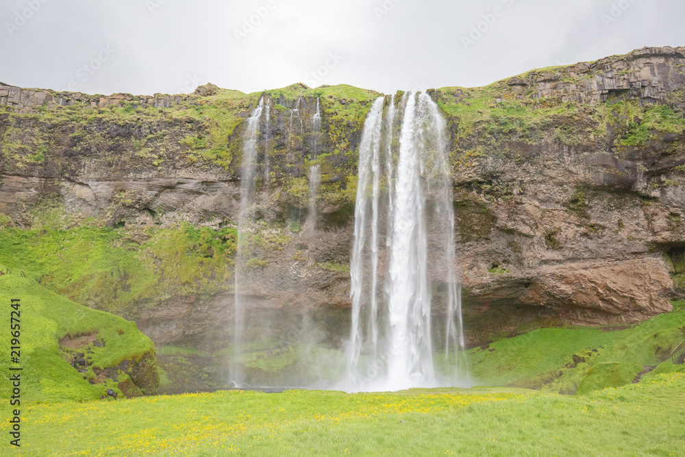 waterfall in iceland in the mountain waterfall in iceland in the mountain