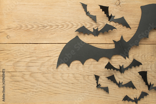 Background for Halloween, with bats on a wooden background