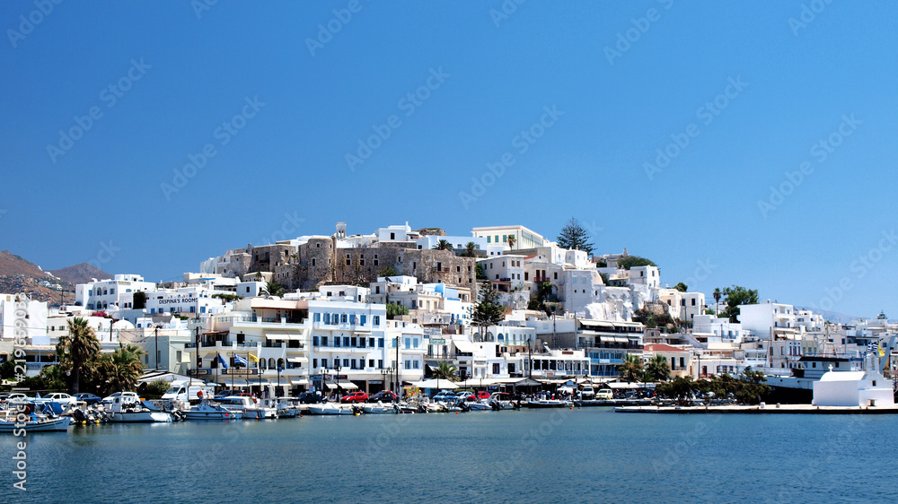 Blue day Naxos island Naphion village view from the ferry, Greece