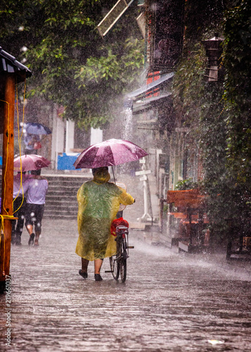 Walking down Yangshuo west street in the rain