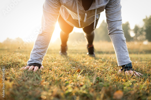 Athletic woman doing push-ups. Hard Workouts. © PAstudio