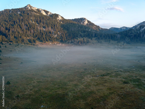 Early morning mist at Veliki Lubenovac, Northern Velebit, Croatia photo