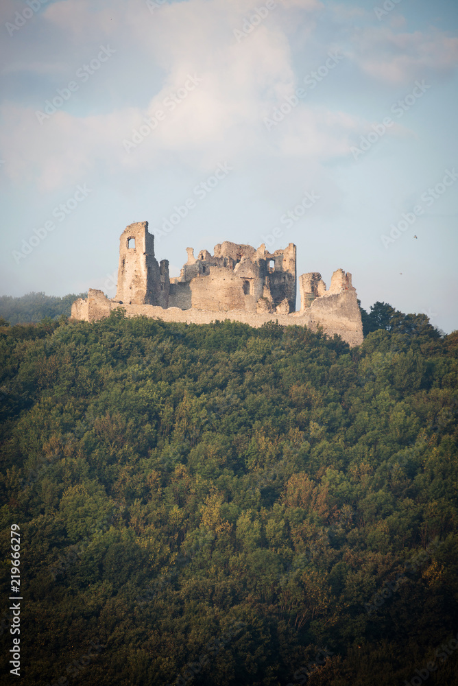 Ruin of Brekov castle on top of the hill in morning light, Slovakia