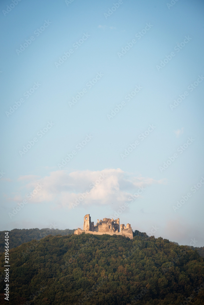 Obraz premium Ruin of Brekov castle on top of the hill in morning light, Slovakia