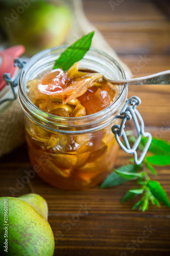 sweet fruit jam with apples and pears in a glass jar