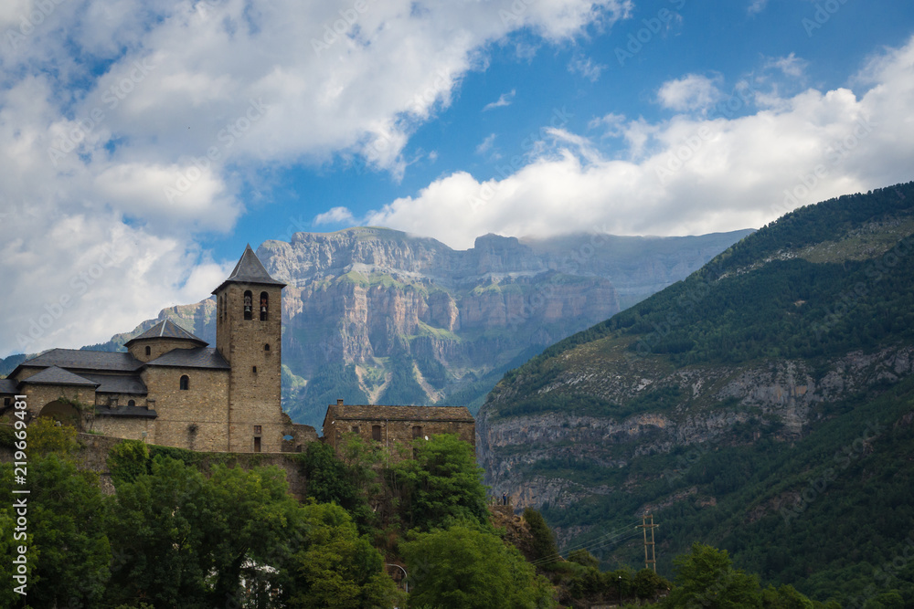 Torla Ordesa, church with the mountains at bottom, Pyrinees Spain