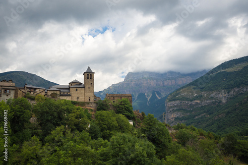 Torla Ordesa, church with the mountains at bottom, Pyrinees Spain