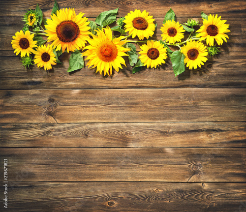 Sunflowers on wooden board