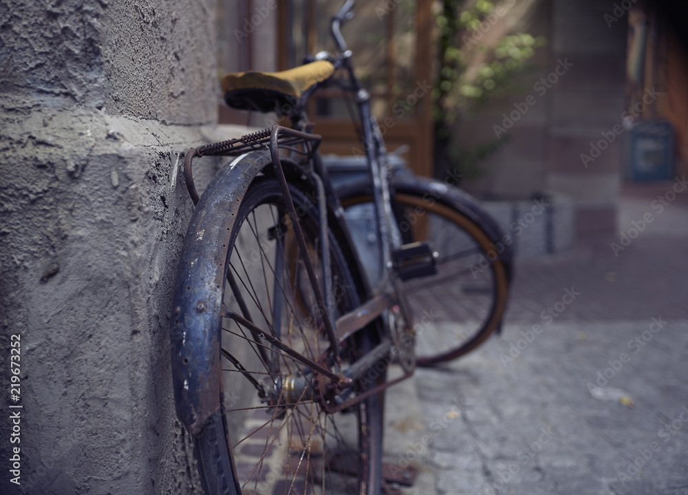 Old bicycle parked on the street