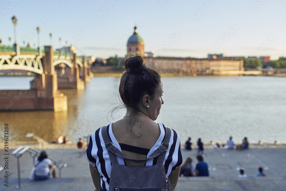 woman sitting in the river in Toulouse