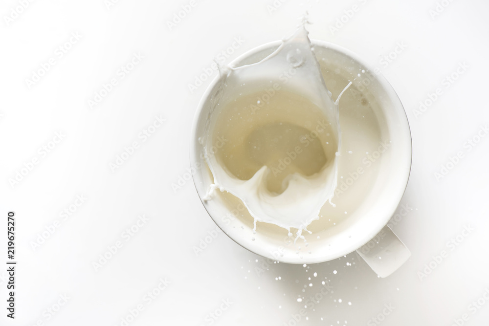 top view of milk splash out of glass isolated on white background top view of milk splash out of glass isolated on white background