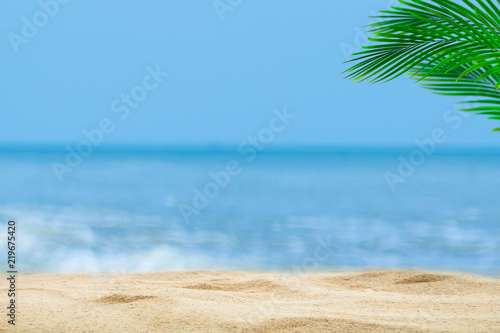 Fototapeta Naklejka Na Ścianę i Meble -  Top of wood table with blurred sea and palm tree background,Concept Summer, Beach, Sea, Relax.