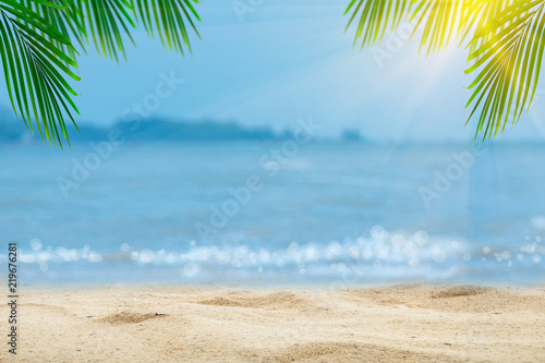 Top of wood table with blurred sea and palm tree background Concept Summer  Beach  Sea  Relax.