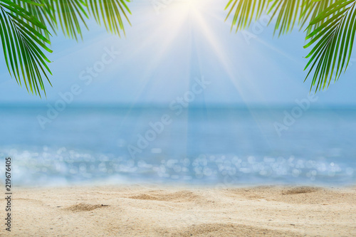 Top of wood table with blurred sea and palm tree background,Concept Summer, Beach, Sea, Relax.