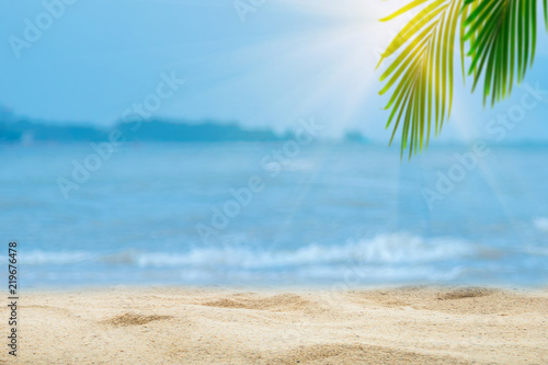 Top of wood table with blurred sea and palm tree background,Concept Summer, Beach, Sea, Relax. © A Stockphoto
