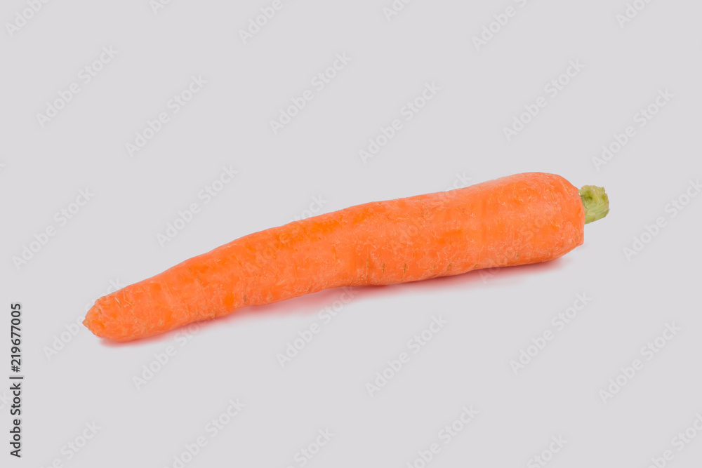 One single carrot isolated on white. Close up. Cut out. One single carrot isolated on white. Close up. Cut out.