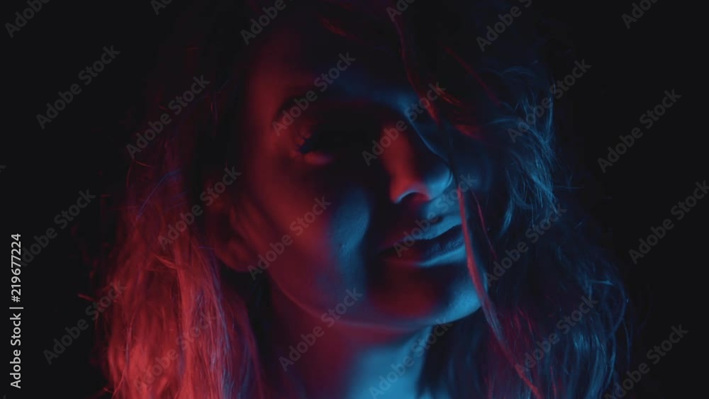 Portrait of beautiful young woman modelling in studio photo shoot (slow motion) Portrait of beautiful young woman modelling in studio photo shoot (slow motion)