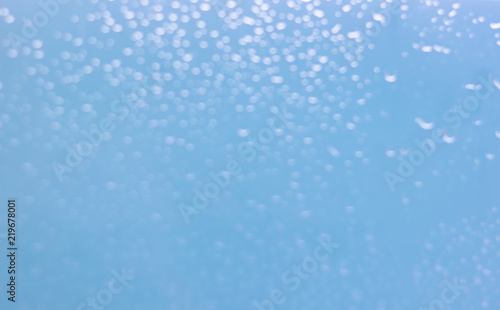 Waterdrops bokeh blue background