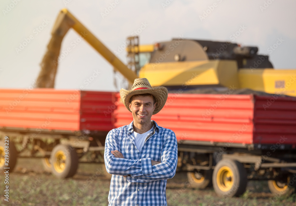 Farmer on field during harvest Farmer on field during harvest