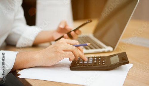Tableau sur toile close up on man hand pressing on calculator for calculating cost estimating , se