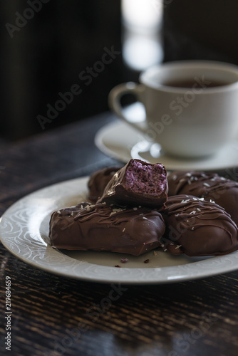 vegan dessert of homemade chocolate bar with shredded coconut and blueberries, bounty style