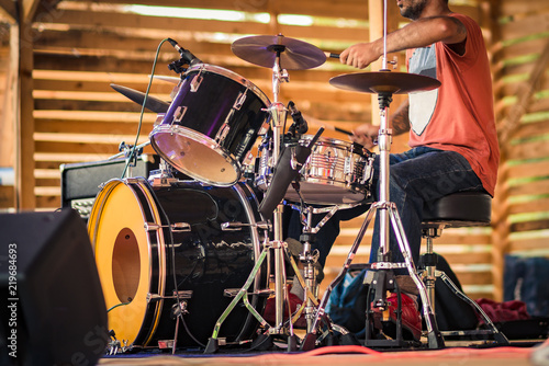 Drummer performing on stage.