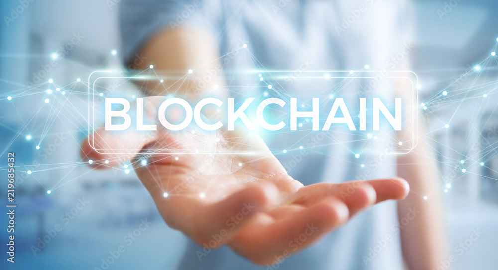 Businessman using blockchain cryptocurrency interface 3D rendering Businessman using blockchain cryptocurrency interface 3D rendering