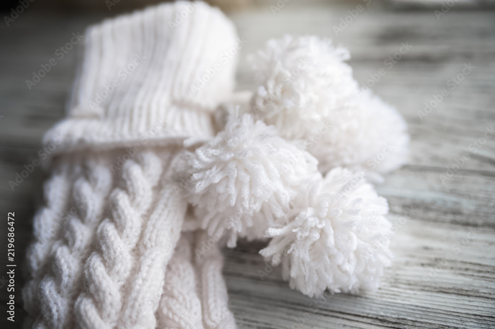White knitted socks, handmade socks on white background. Texture of knitted things White knitted socks, handmade socks on white background. Texture of knitted things