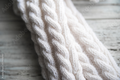 White knitted socks, handmade socks on white background. Texture of knitted things