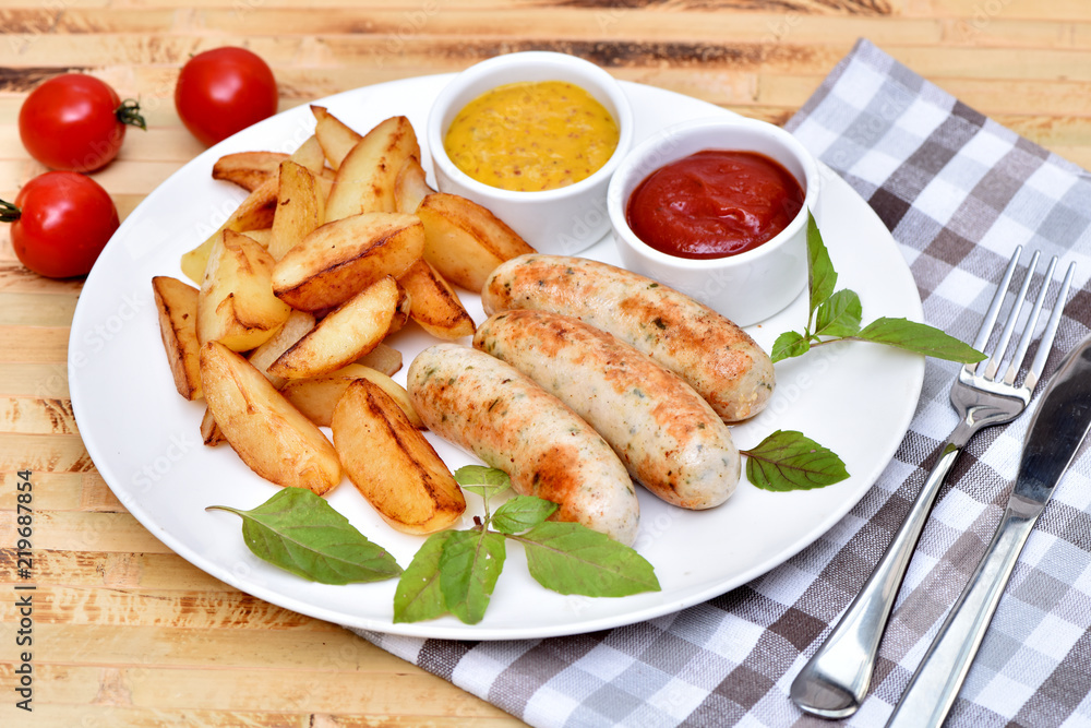 Bavarian sausages. German cuisine. A dish of chicken meat. Bavarian sausages. German cuisine. A dish of chicken meat.