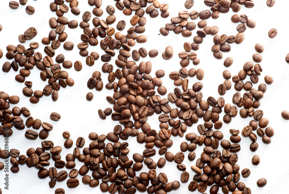 Scattered Brown Coffee Beans on White Background Scattered Brown Coffee Beans on White Background