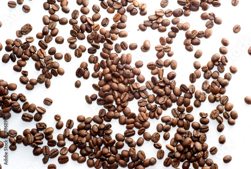 Scattered Brown Coffee Beans on White Background
