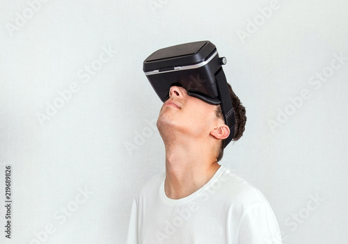 Young Man in VR Glasses © Sabphoto