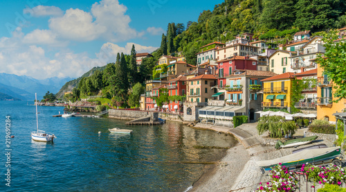 Fototapeta Naklejka Na Ścianę i Meble -  Beautiful Varenna waterfront on a sunny summer afternoon, Lake Como, Lombardy, Italy.