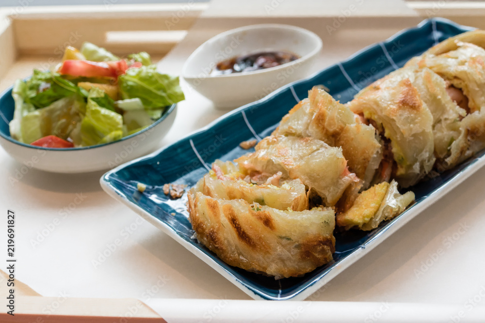 Traditional Taiwanese fried pancake with bacon and cheese filling