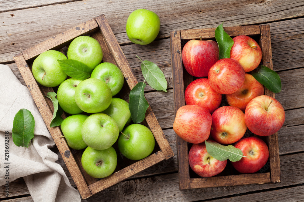 Green and red apples in wooden box Green and red apples in wooden box