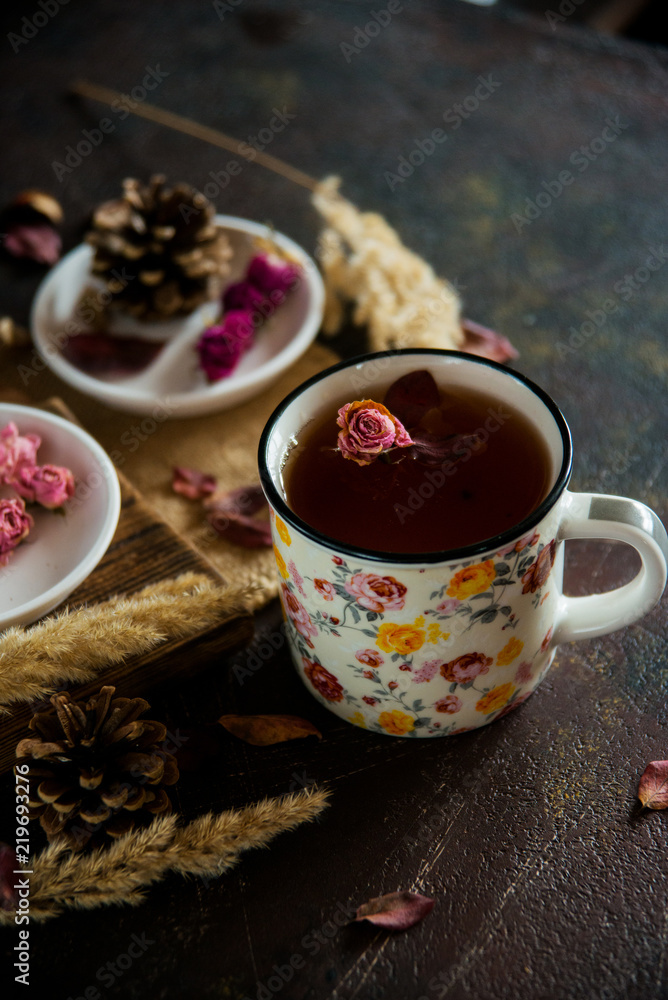 Tea with edible flowers, pansies. The concept of a cozy home autumn tea party Tea with edible flowers, pansies. The concept of a cozy home autumn tea party