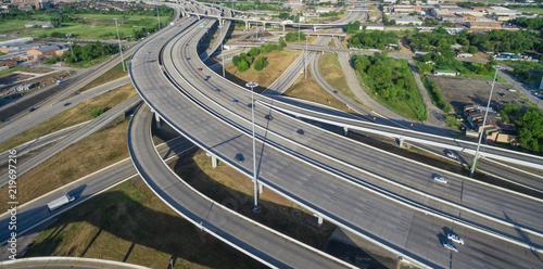 Panorama aerial view massive interstate I69 highway intersection, stack interchange with elevated road junction overpass in downtown Houston. This five-level freeway interchange carry heavy traffic. photo