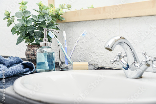 Bathroom set with toothbrushes  towels and soap
